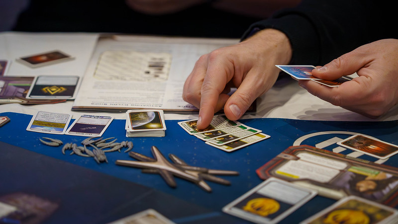 An image of somebody playing the Battlestar Galactica board game. 
